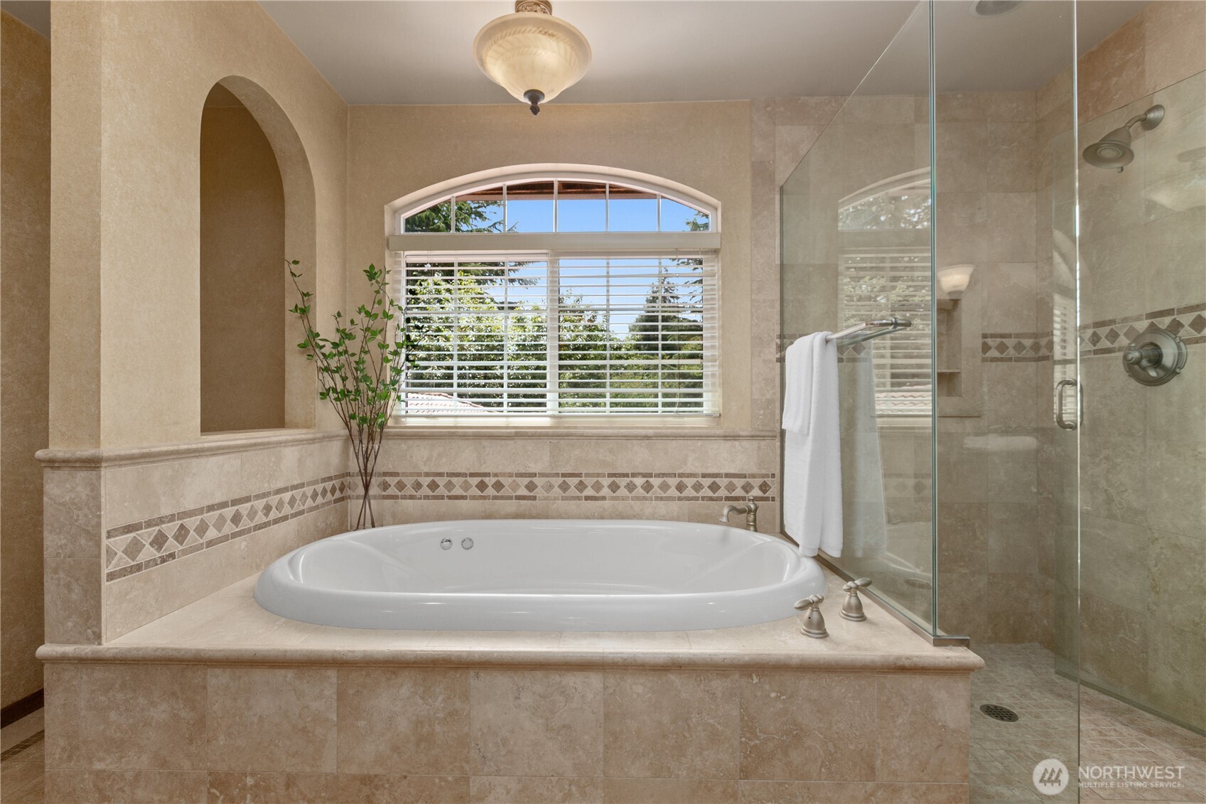 1788 Matz Road Ferndale, WA 98248 - Photo 23 of 40 a bathroom with a tub a sink and a window