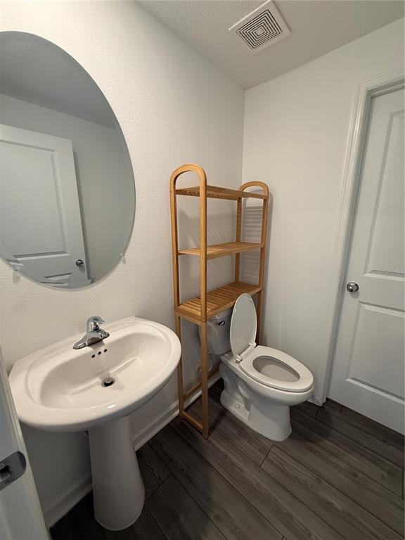 4701 Southwest 83rd Loop Ocala, FL 34476 - Photo 15 of 17 a bathroom with a sink toilet and mirror