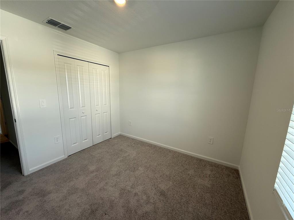 4701 Southwest 83rd Loop Ocala, FL 34476 - Photo 16 of 17 an empty room with windows