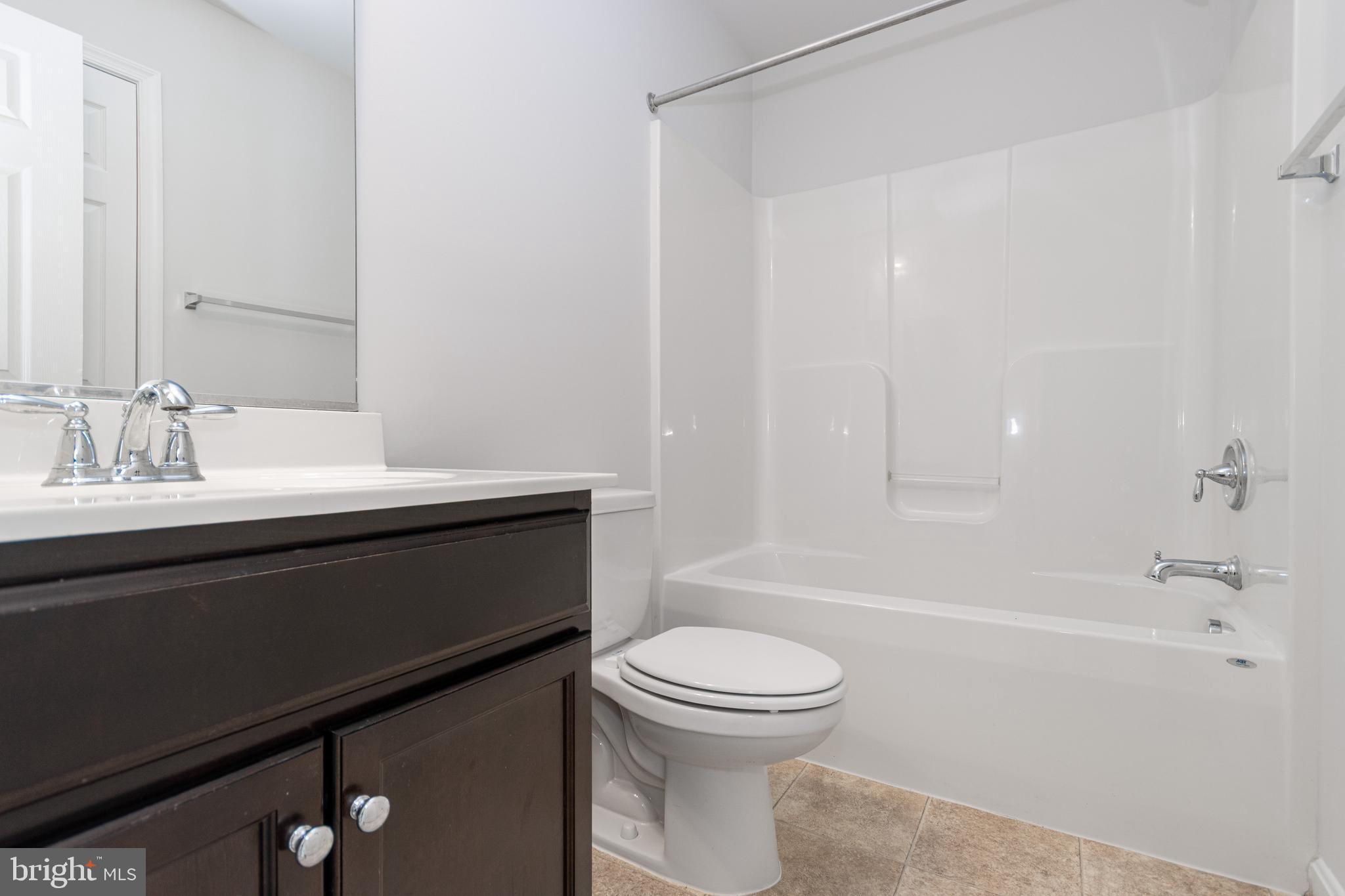 4905 Wensel Road Fredericksburg, VA 22408 - Photo 14 of 23 a bathroom with a sink a toilet and shower