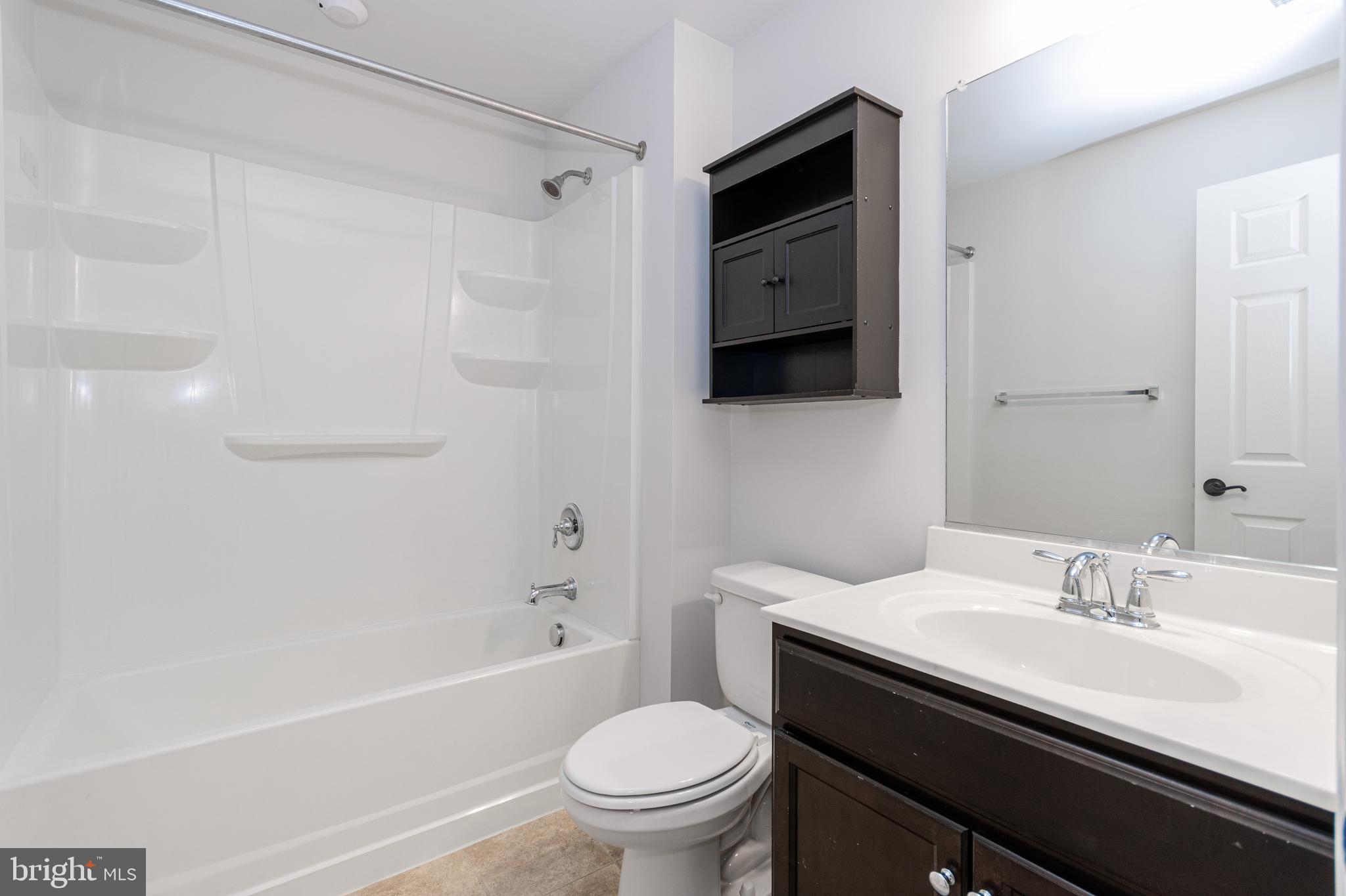 4905 Wensel Road Fredericksburg, VA 22408 - Photo 17 of 23 a bathroom with a sink a toilet and a bathtub