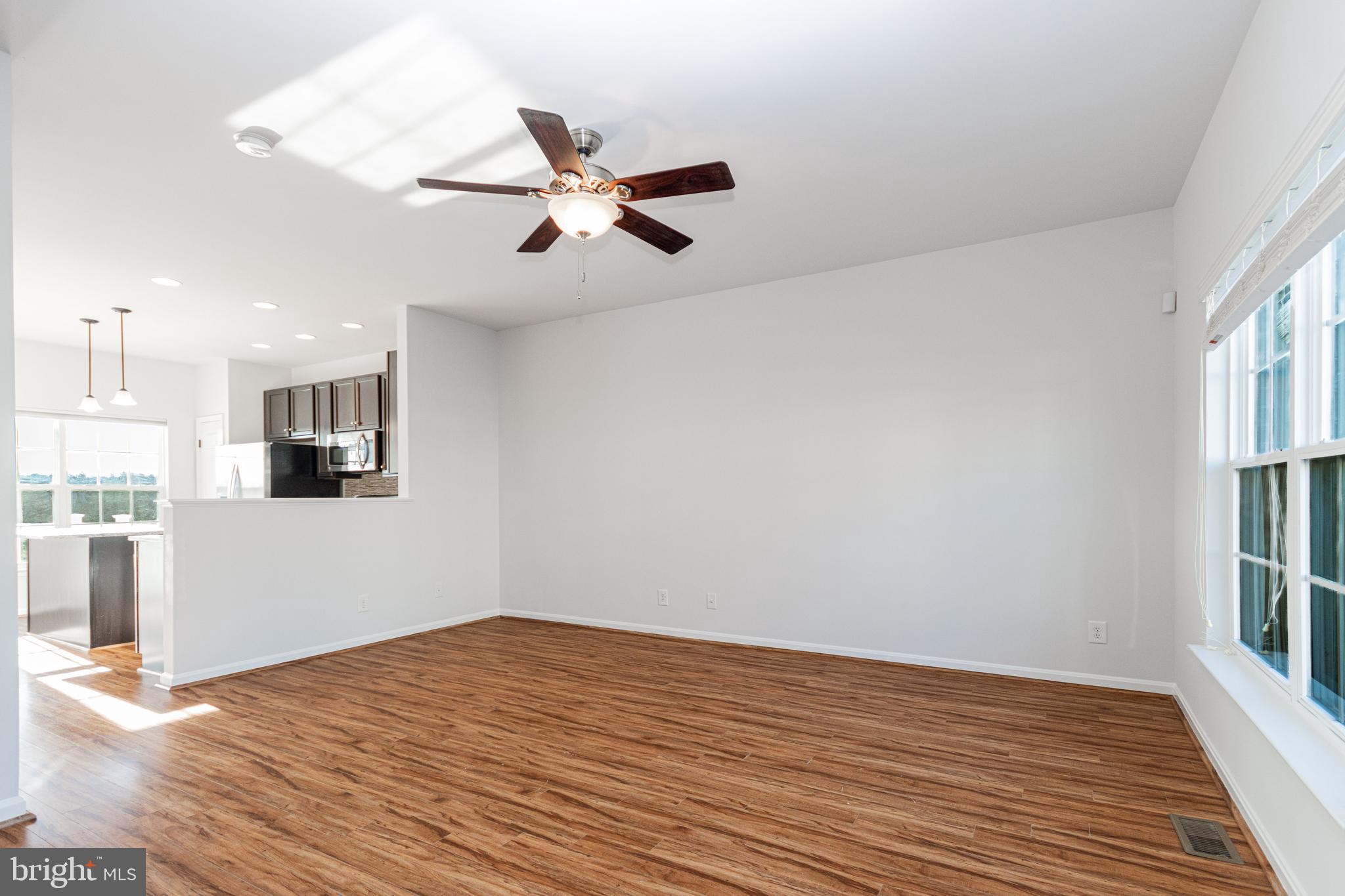 4905 Wensel Road Fredericksburg, VA 22408 - Photo 2 of 23 a view of empty room with wooden floor and fan