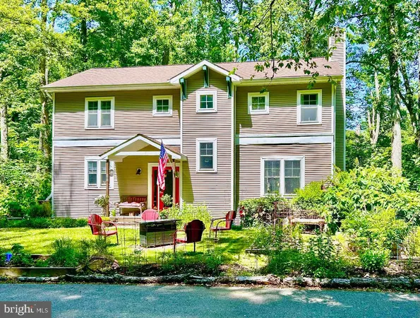 a view of a house with a yard and plants