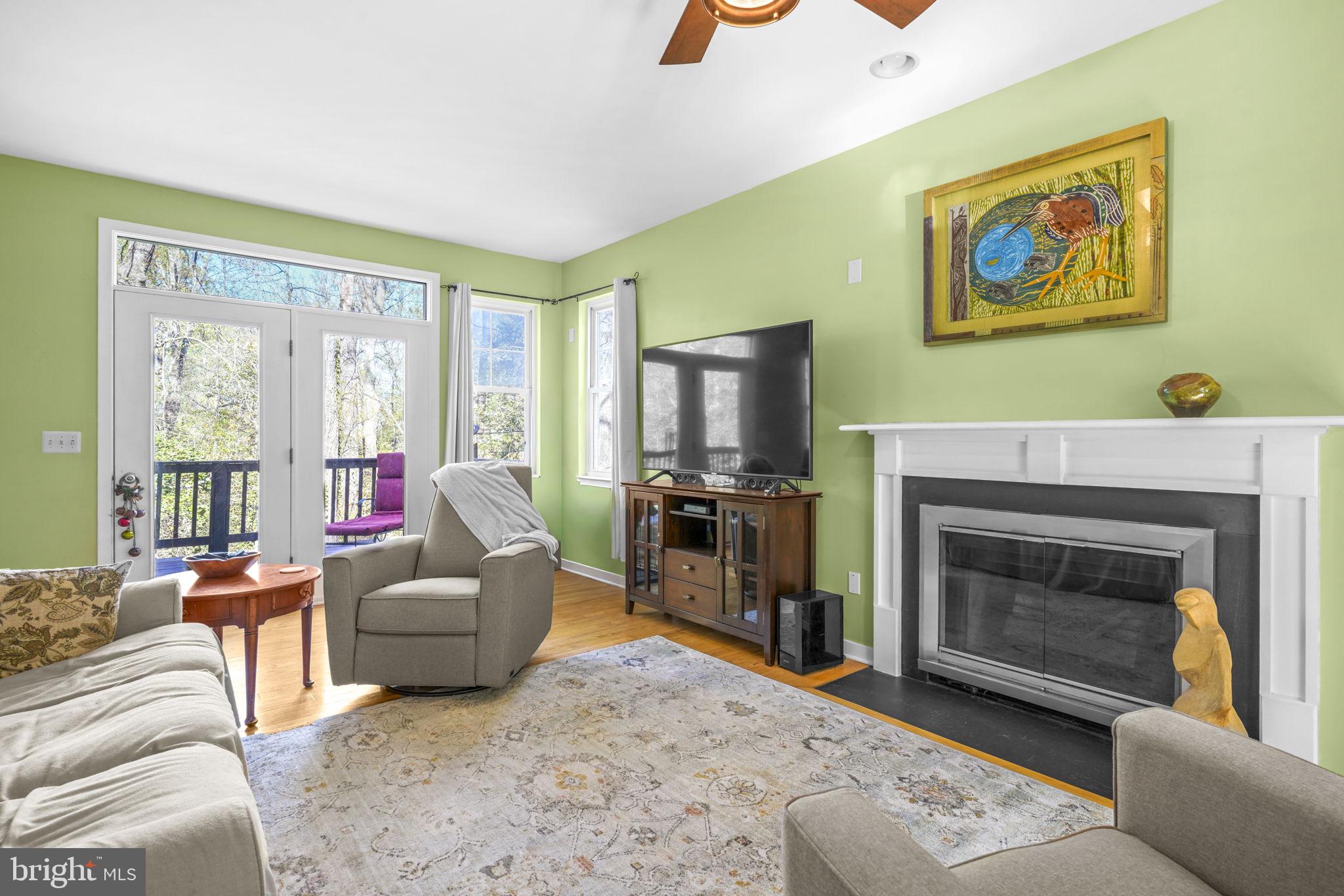 90 Park Avenue Edgewater, MD 21037 - Photo 14 of 44 a living room with furniture a flat screen tv and a fireplace