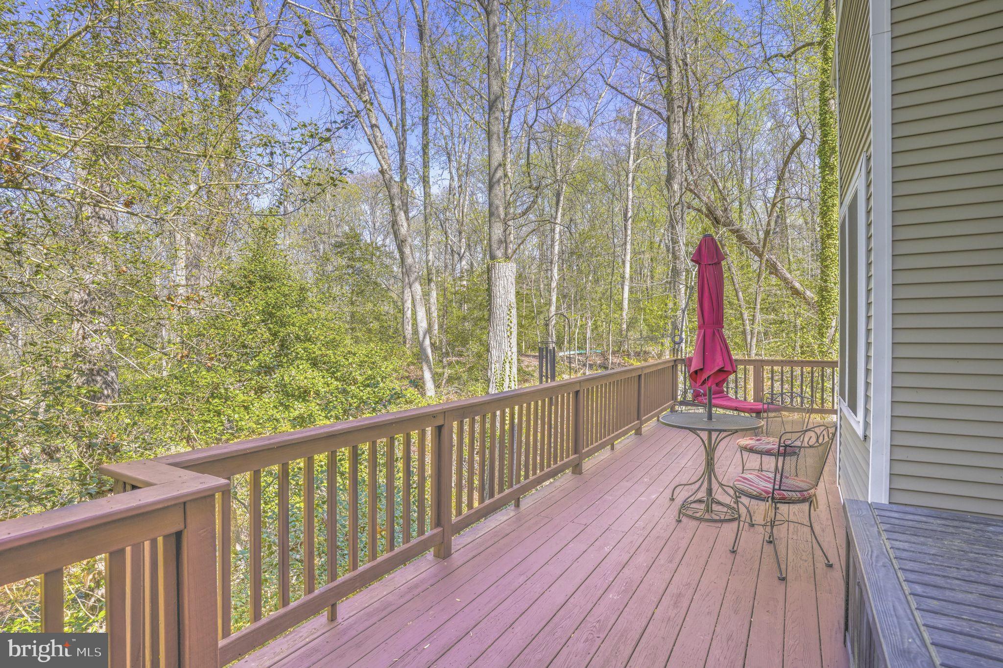 90 Park Avenue Edgewater, MD 21037 - Photo 16 of 44 a balcony with wooden floor and bench