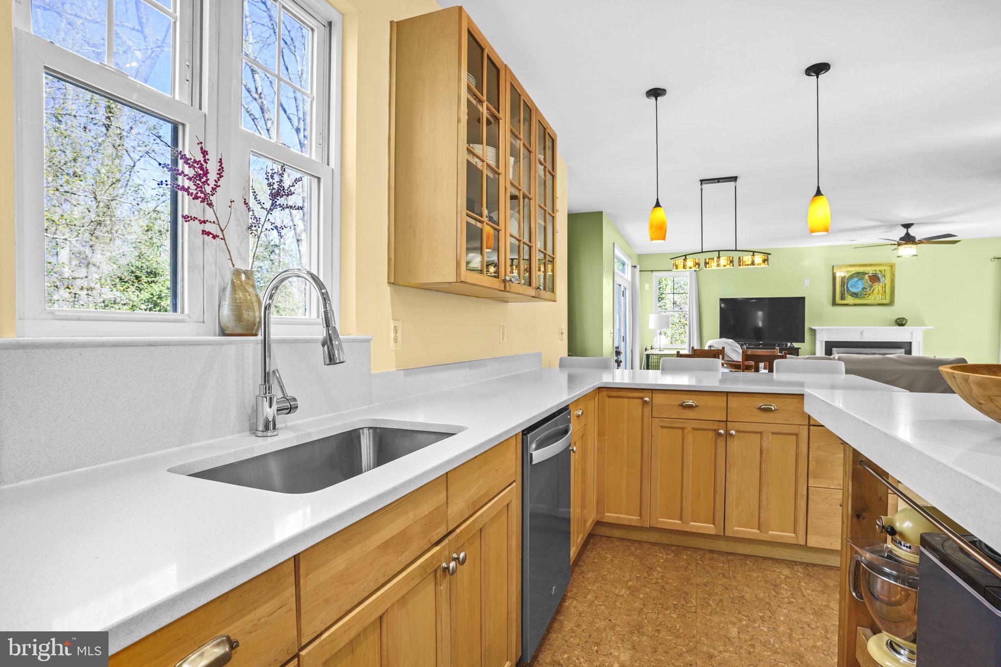 90 Park Avenue Edgewater, MD 21037 - Photo 8 of 44 a kitchen with stainless steel appliances a sink a stove and a wooden floor