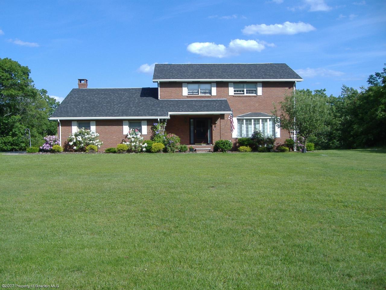 a front view of house with yard