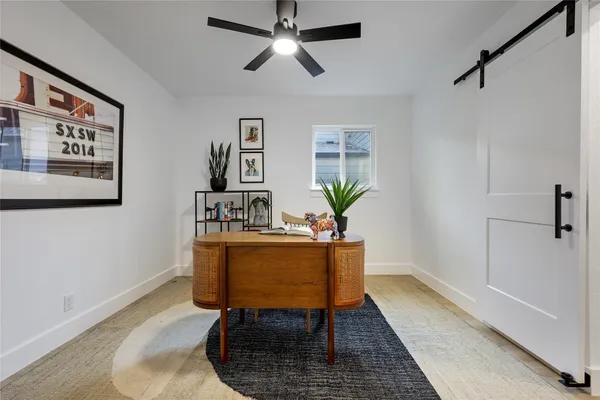 a view of a workspace with furniture