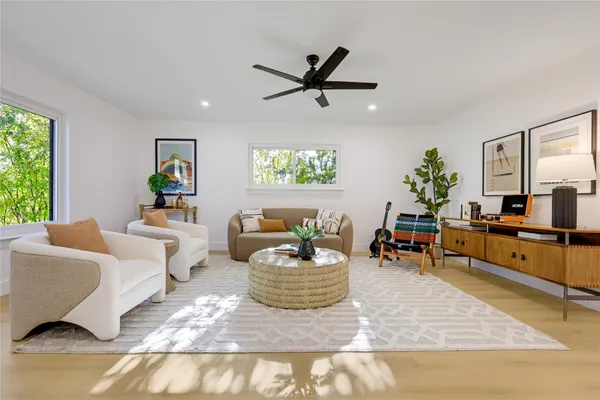 a living room with furniture and a large window