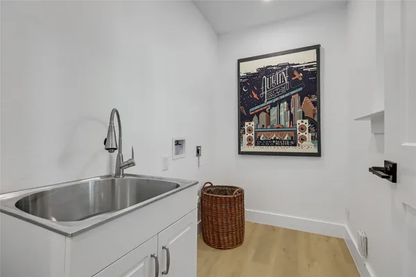a view of a deck in the house with a big yard and large trees