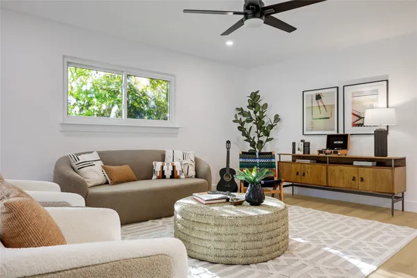a living room with furniture and a large window