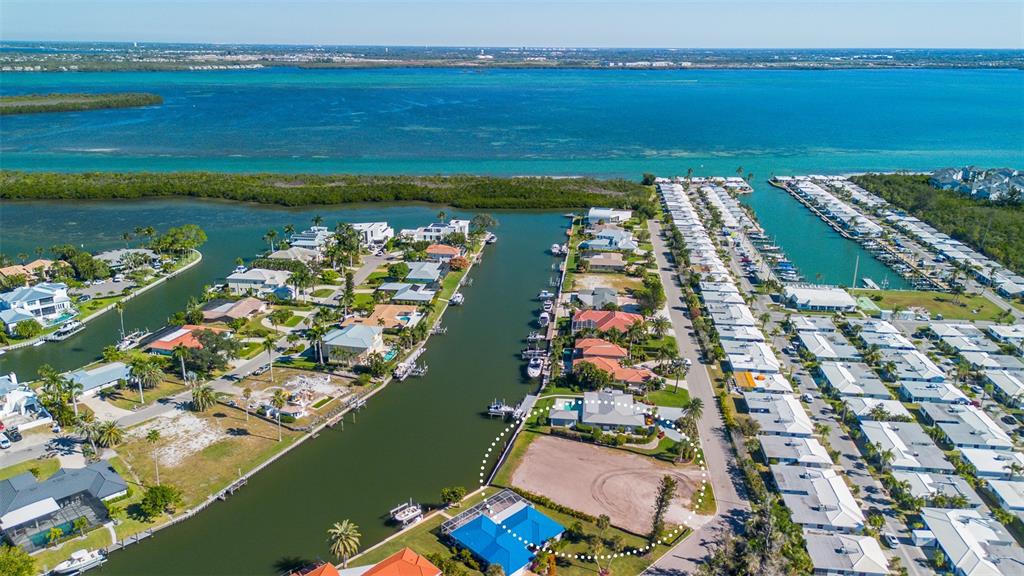 721 Binnacle Point Drive Longboat Key, FL 34228 - Photo 3 of 12 an aerial view of ocean and residential houses with outdoor space