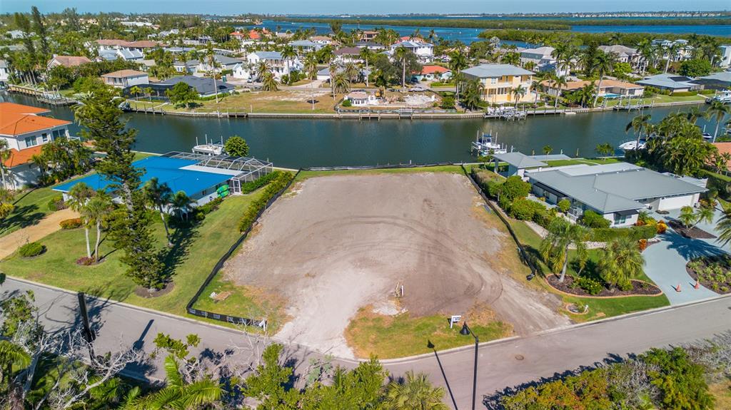 721 Binnacle Point Drive Longboat Key, FL 34228 - Photo 7 of 12 an aerial view of a house with a table and a chairs