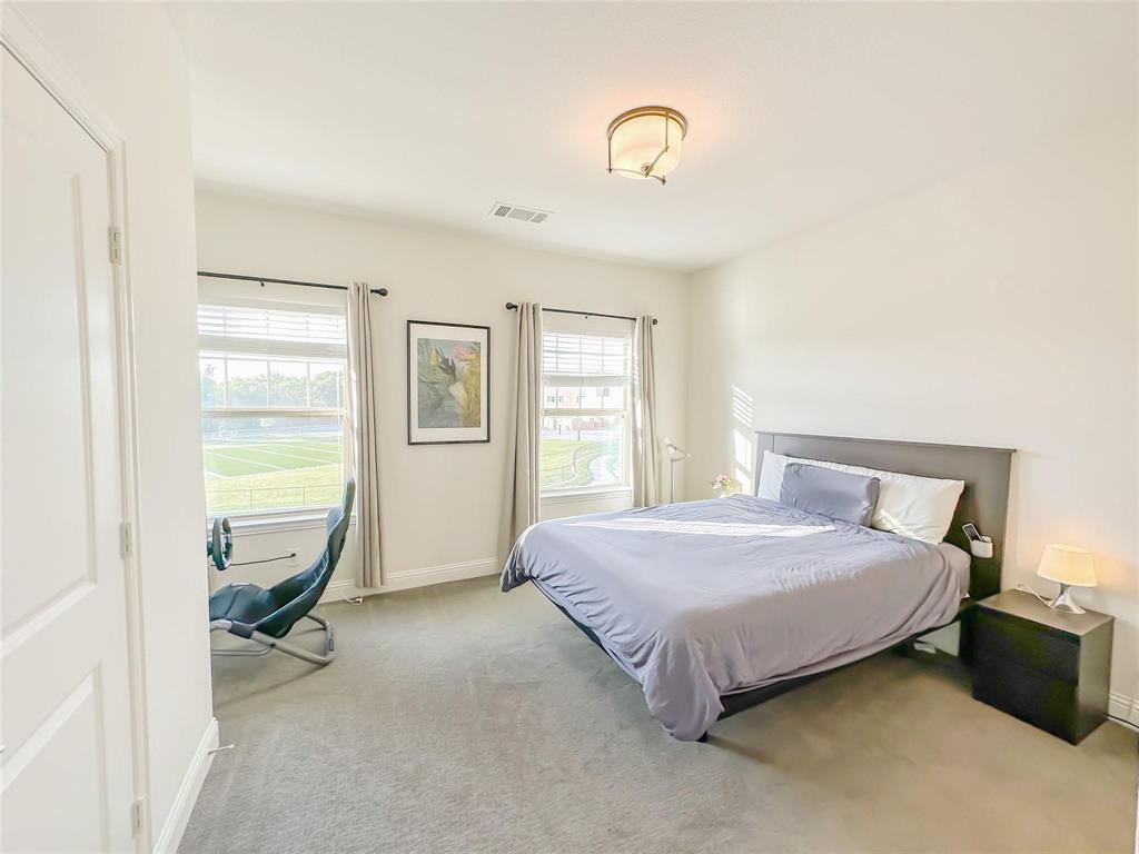 7605 Kickapoo Drive McKinney, TX 75070 - Photo 7 of 18 a bedroom with a bed and a window
