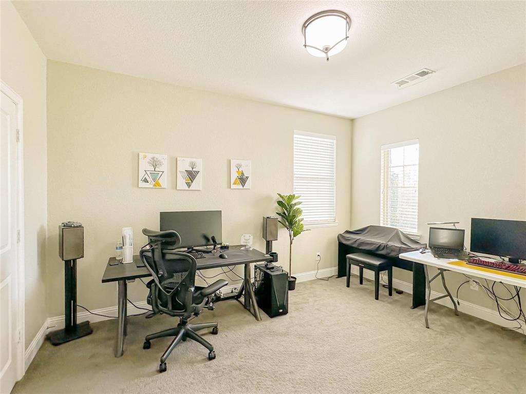 7605 Kickapoo Drive McKinney, TX 75070 - Photo 8 of 18 a view of a workspace with furniture and a window