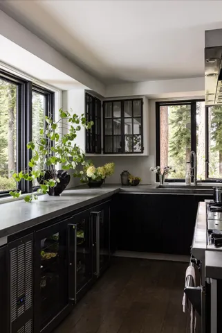 a kitchen with a sink and wooden cabinets