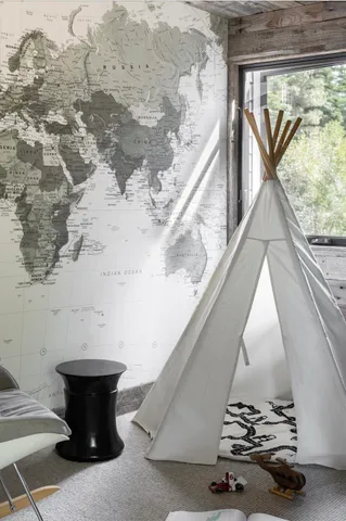 a spacious bedroom with a bed a table and chair