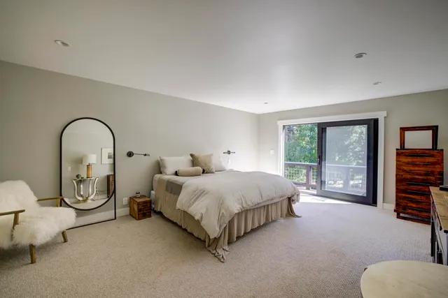 a bathroom with a shower a toilet and a sink