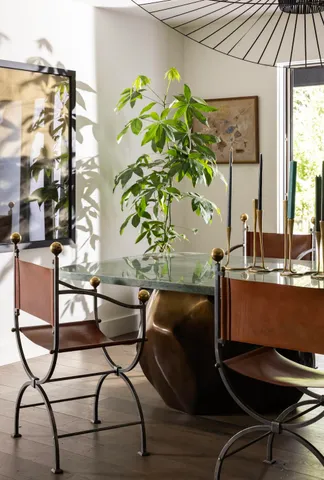a view of a room with a table and chairs
