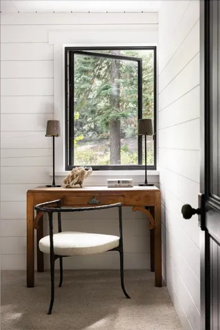a kitchen with a table chairs stove and cabinets