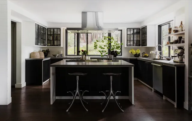 a kitchen with a sink and large window