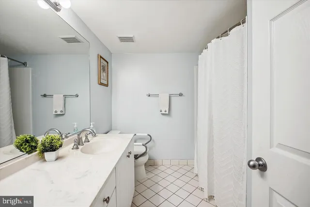 a bedroom with a bed and a television