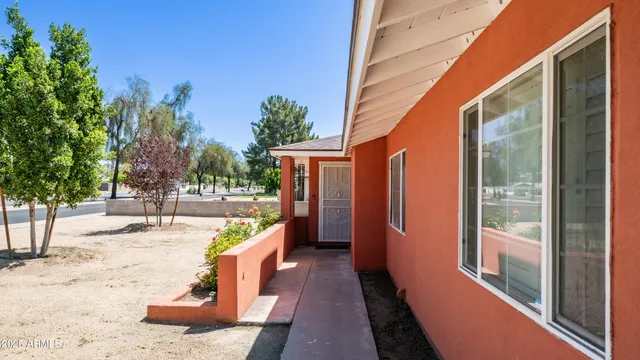 a view of a balcony with wooden floor and fence