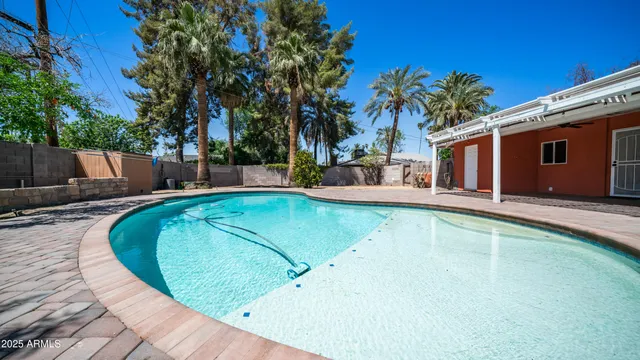 swimming pool view with a outdoor seating