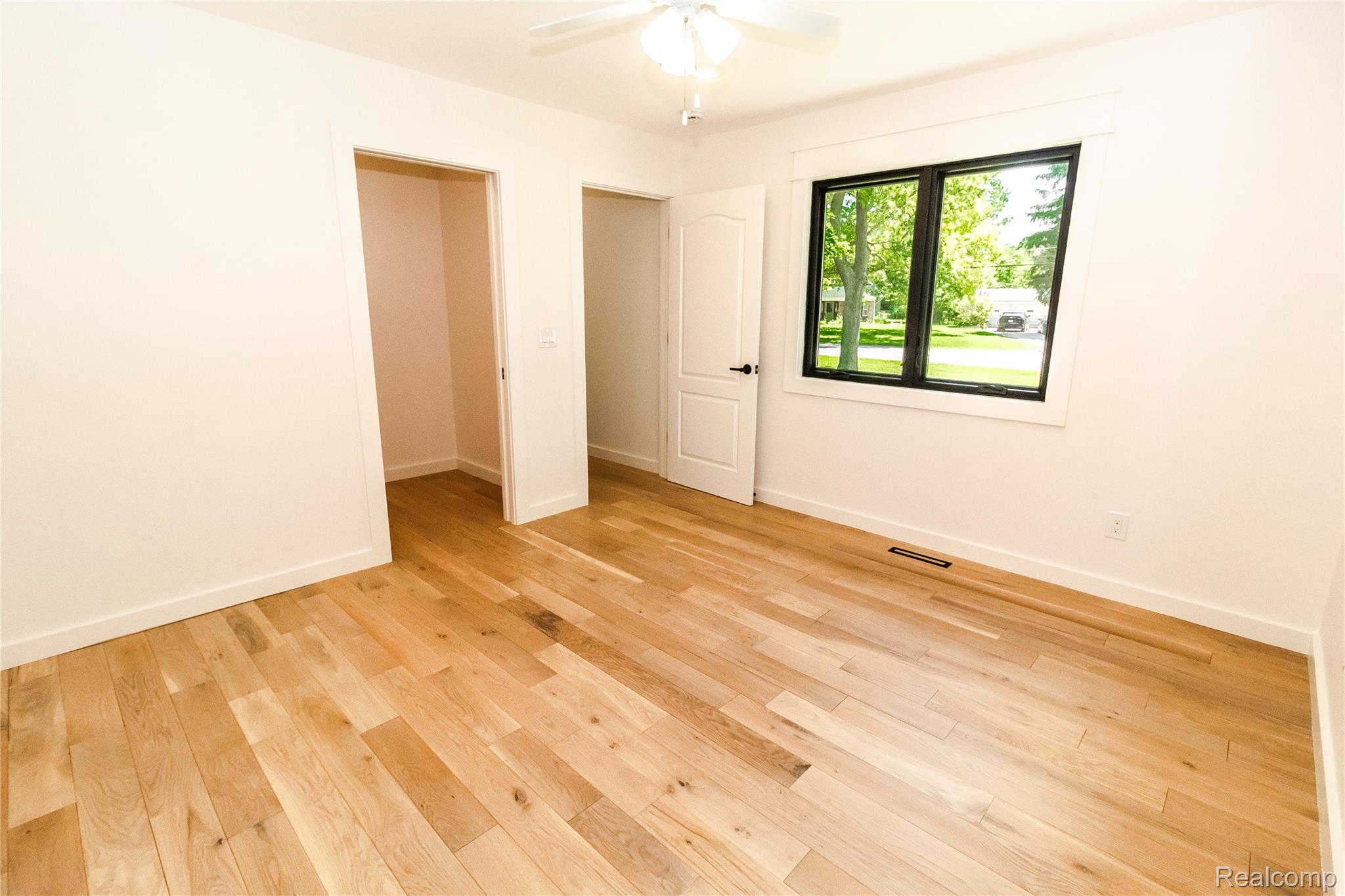 1138 Baldwin Road Lapeer, MI 48446 - Photo 27 of 49 Light wood-finish flooring complemented by crisp white walls