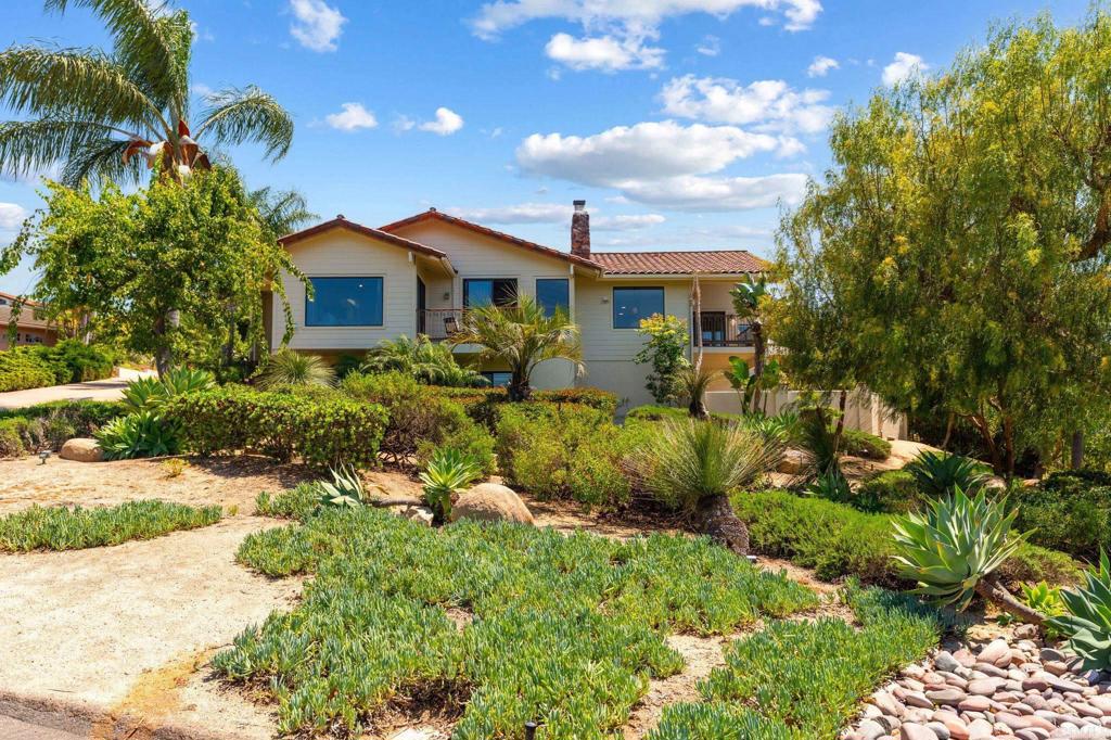 13319 Pacer Lane Poway, CA 92064 - Photo 2 of 75 a view of a house with a yard and potted plants