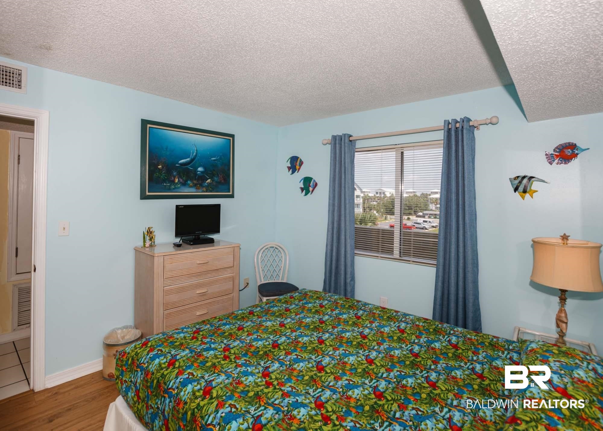 645 Plantation Road, Unit 6311 Gulf Shores, AL 36542 - Photo 11 of 43 Bedroom featuring a textured ceiling and wood finished floors