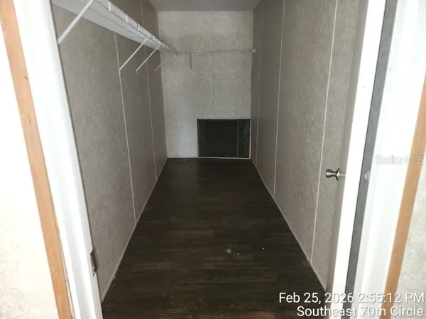 a bathroom with a sink a toilet a mirror and vanity