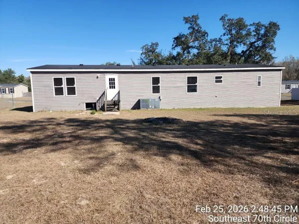 a view of back yard of the house