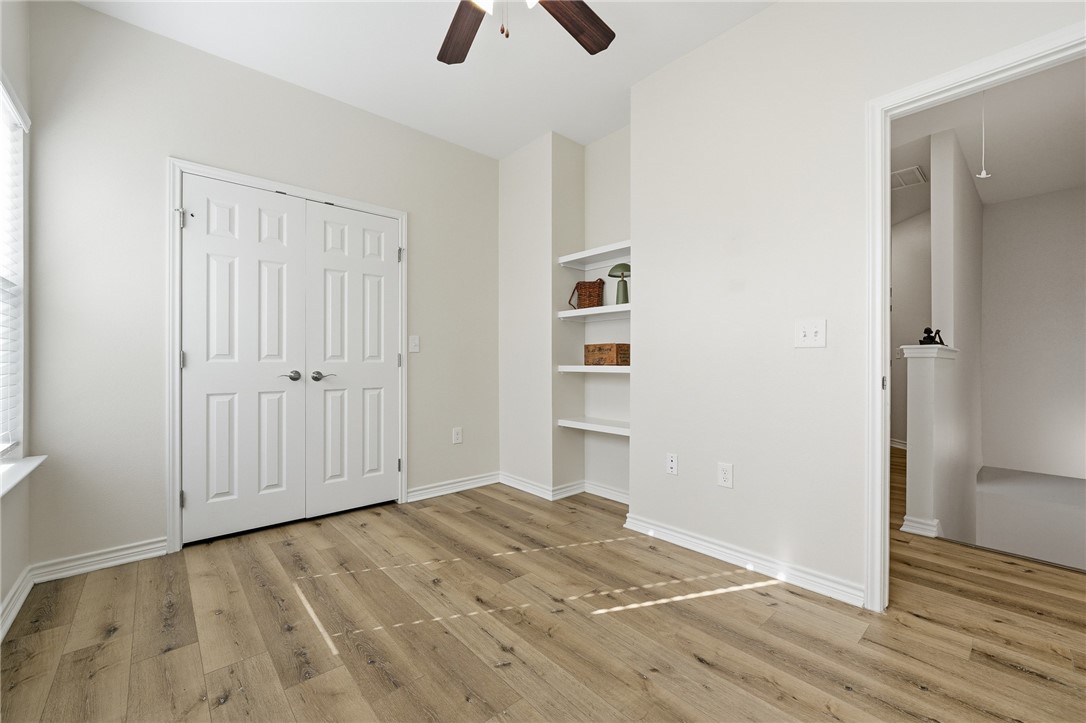 124 Lavaca Rockport, TX 78382 - Photo 19 of 39 an empty room with closet and windows