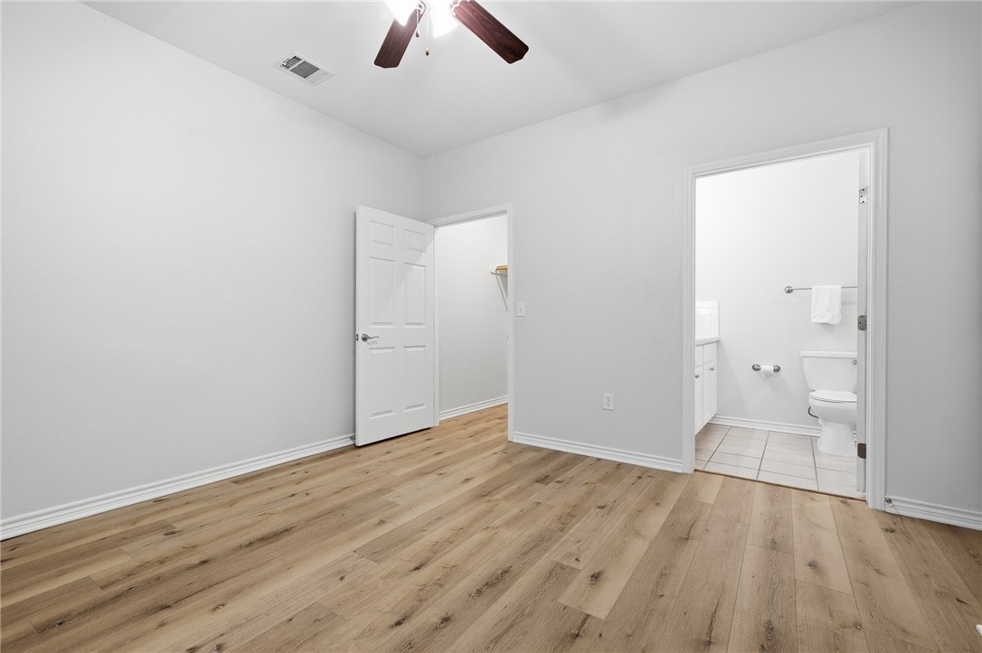 124 Lavaca Rockport, TX 78382 - Photo 23 of 39 an empty room with wooden floor and closet