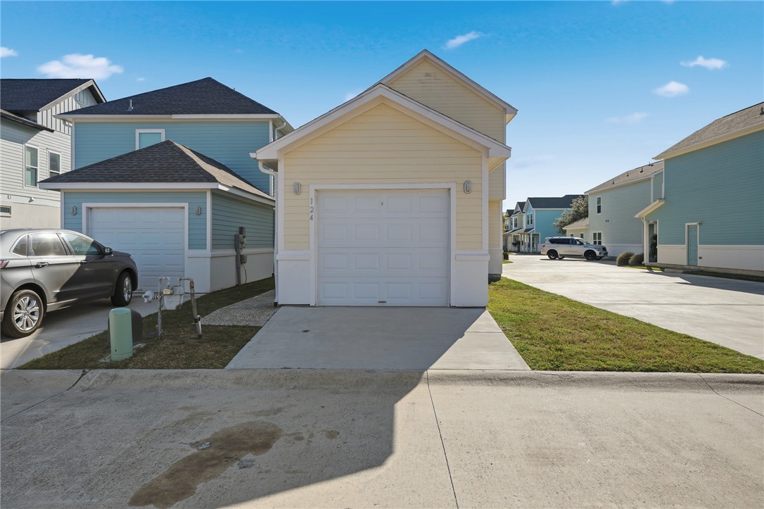 124 Lavaca Rockport, TX 78382 - Photo 29 of 39 a front view of a house with a yard