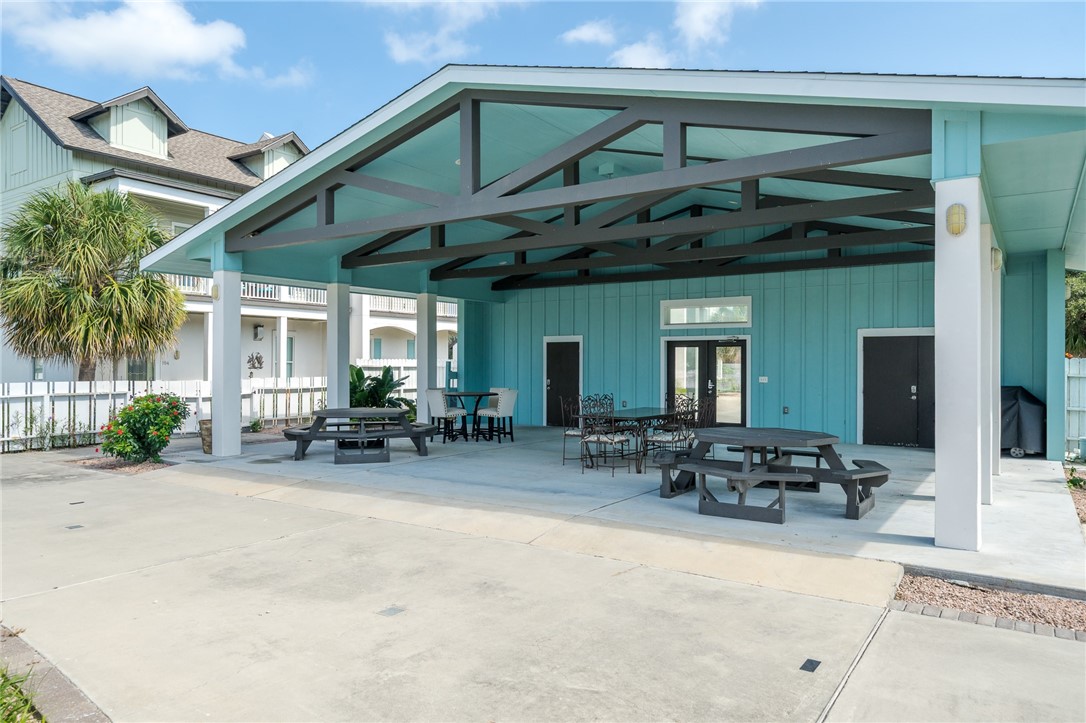 124 Lavaca Rockport, TX 78382 - Photo 34 of 39 a view of the patio with table and chairs under an umbrella