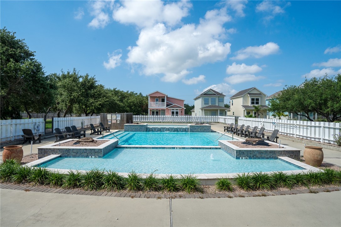 124 Lavaca Rockport, TX 78382 - Photo 35 of 39 a view of a house with swimming pool and sitting area