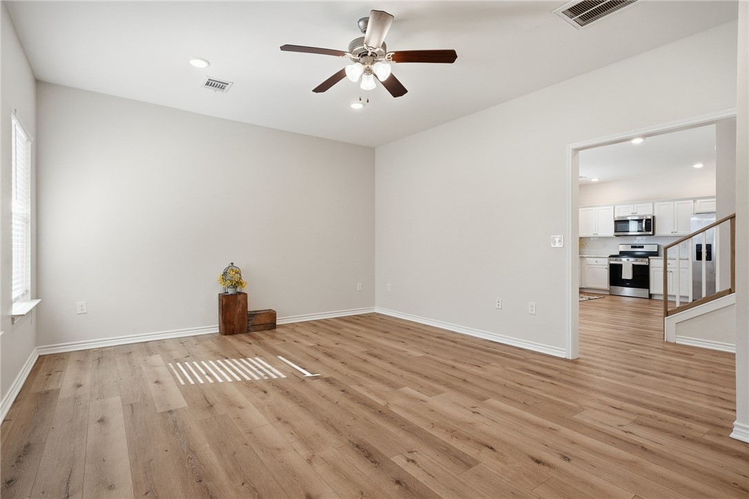 124 Lavaca Rockport, TX 78382 - Photo 6 of 39 a view of empty room with wooden floor