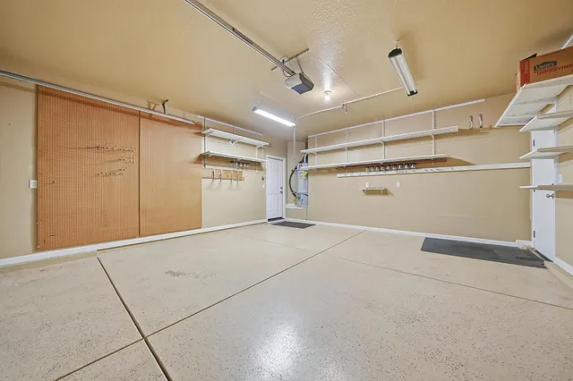 a view of a porch with wooden stairs and a patio