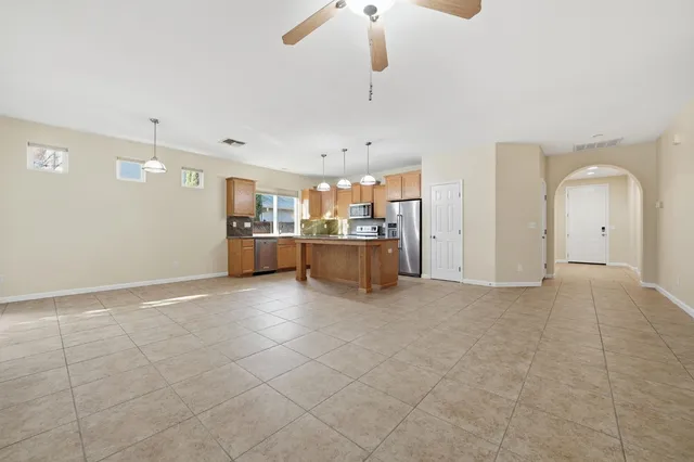 a view of a kitchen with a sink and a stove top oven