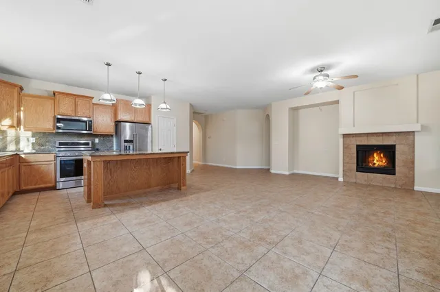 a large kitchen with cabinets and stainless steel appliances