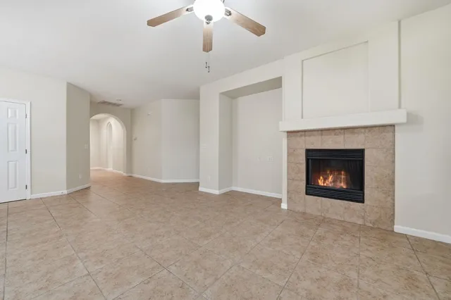 a view of an empty room with a fireplace