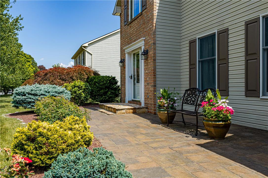 4568 Greenfield Road Bethlehem, PA 18017 - Photo 47 of 59 A welcoming brick and siding facade with mature landscaping and a paver pathway.