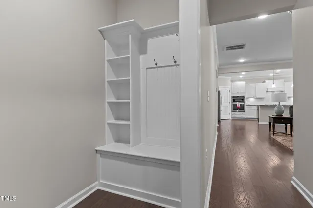 a view of a livingroom with furniture and a chandelier