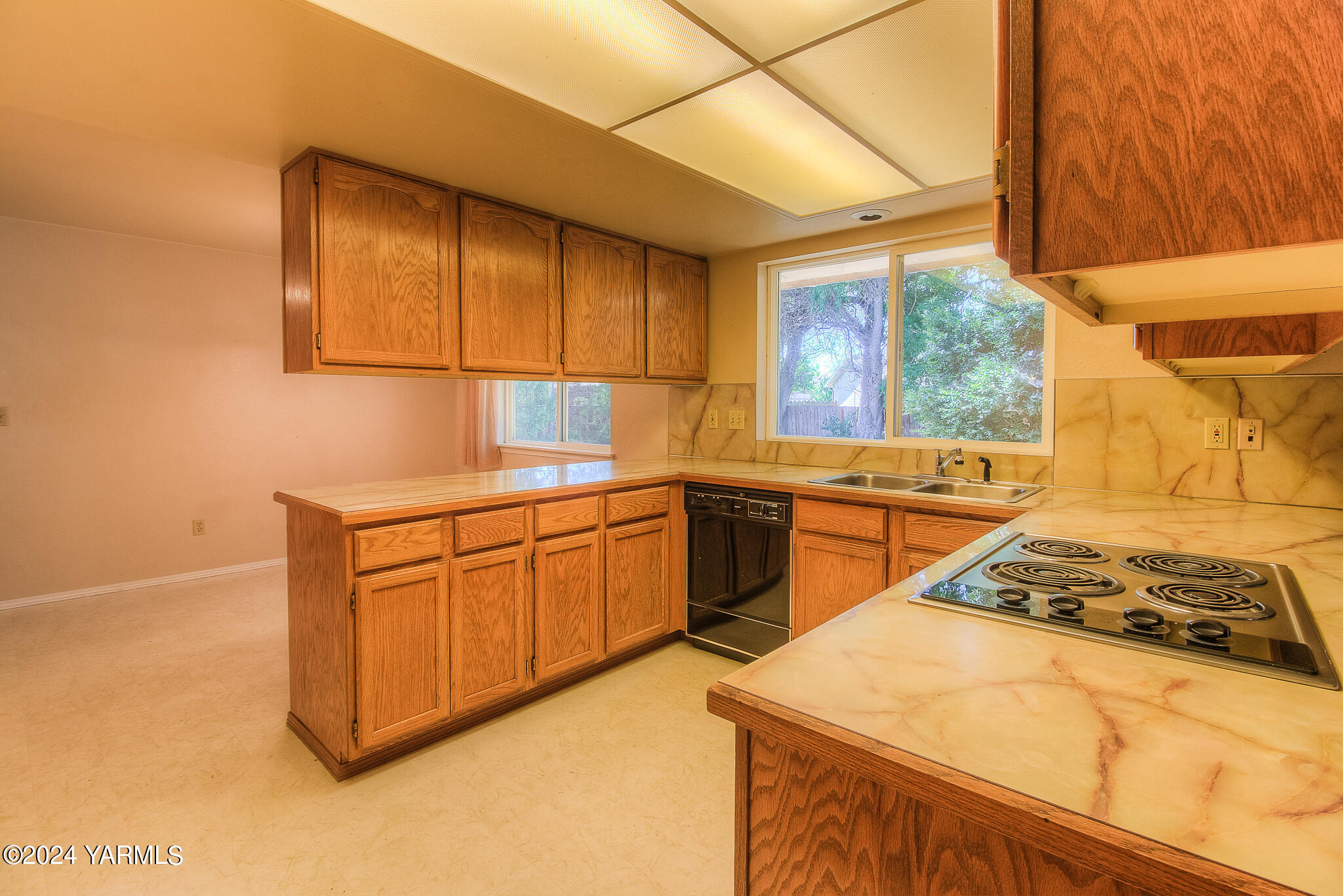 1729 Parsons Loop Yakima, WA 98908 - Photo 11 of 27 a kitchen that has a sink and a stove