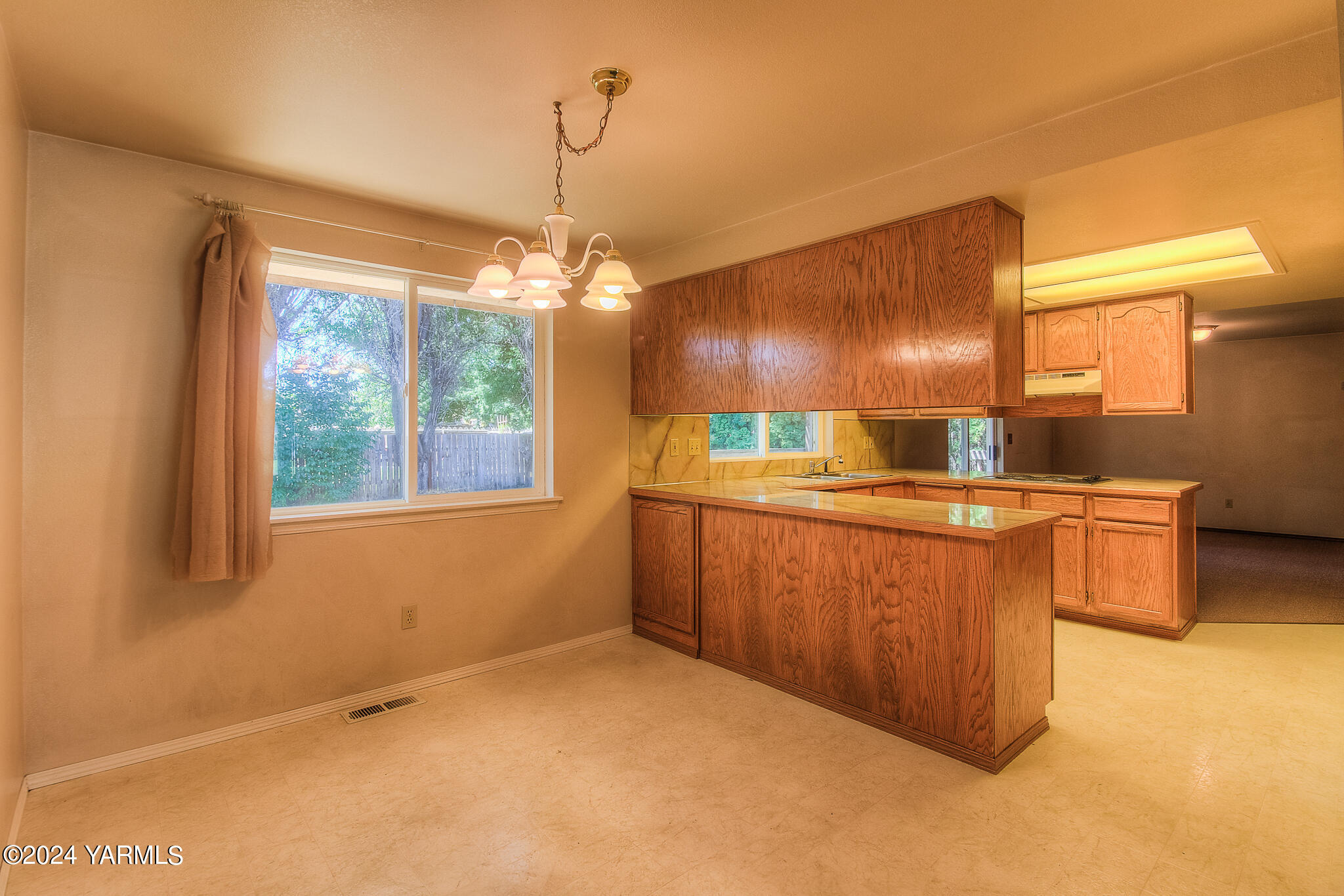 1729 Parsons Loop Yakima, WA 98908 - Photo 13 of 27 a kitchen with stainless steel appliances granite countertop a sink a stove and a refrigerator