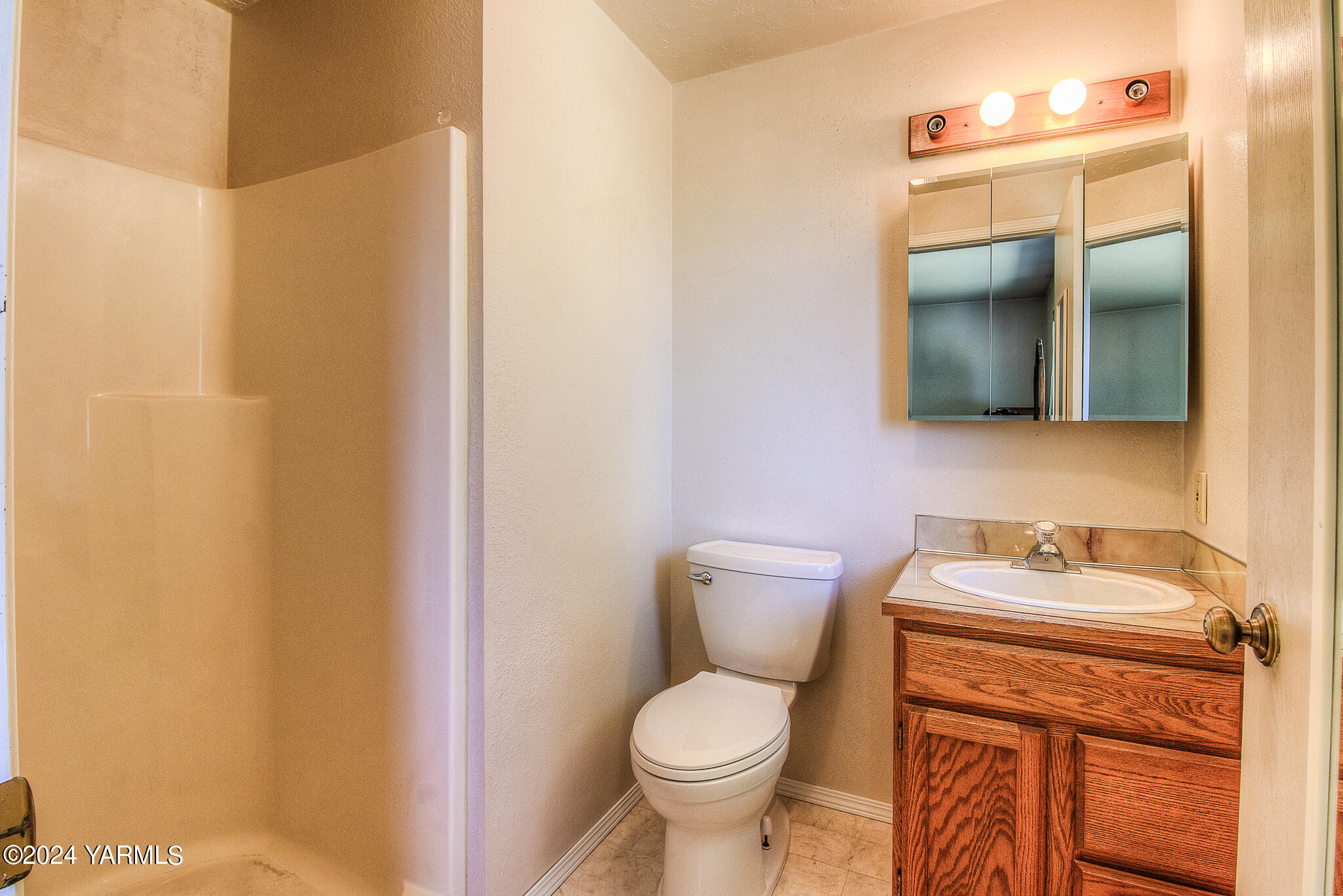 1729 Parsons Loop Yakima, WA 98908 - Photo 19 of 27 a bathroom with a toilet sink and mirror