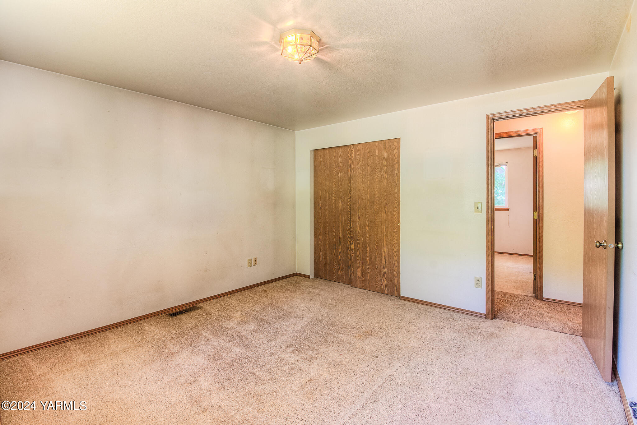 1729 Parsons Loop Yakima, WA 98908 - Photo 21 of 27 a view of an empty room and chandelier fan