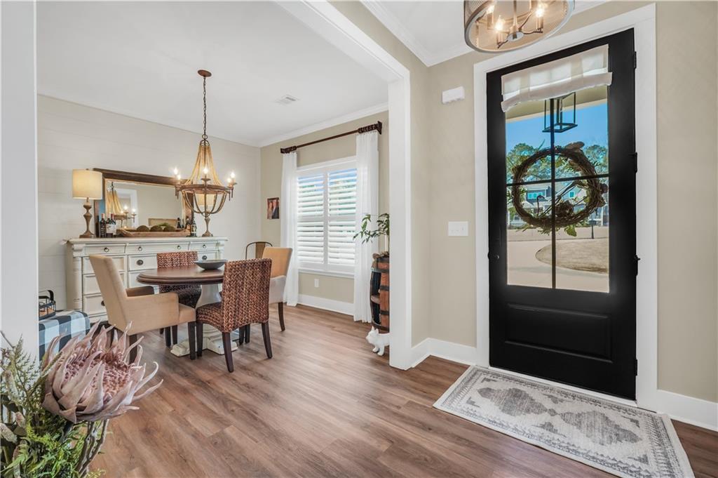230 Alcovy Reserve Way Covington, GA 30014 - Photo 11 of 53 a view of a dining room with furniture window and wooden floor